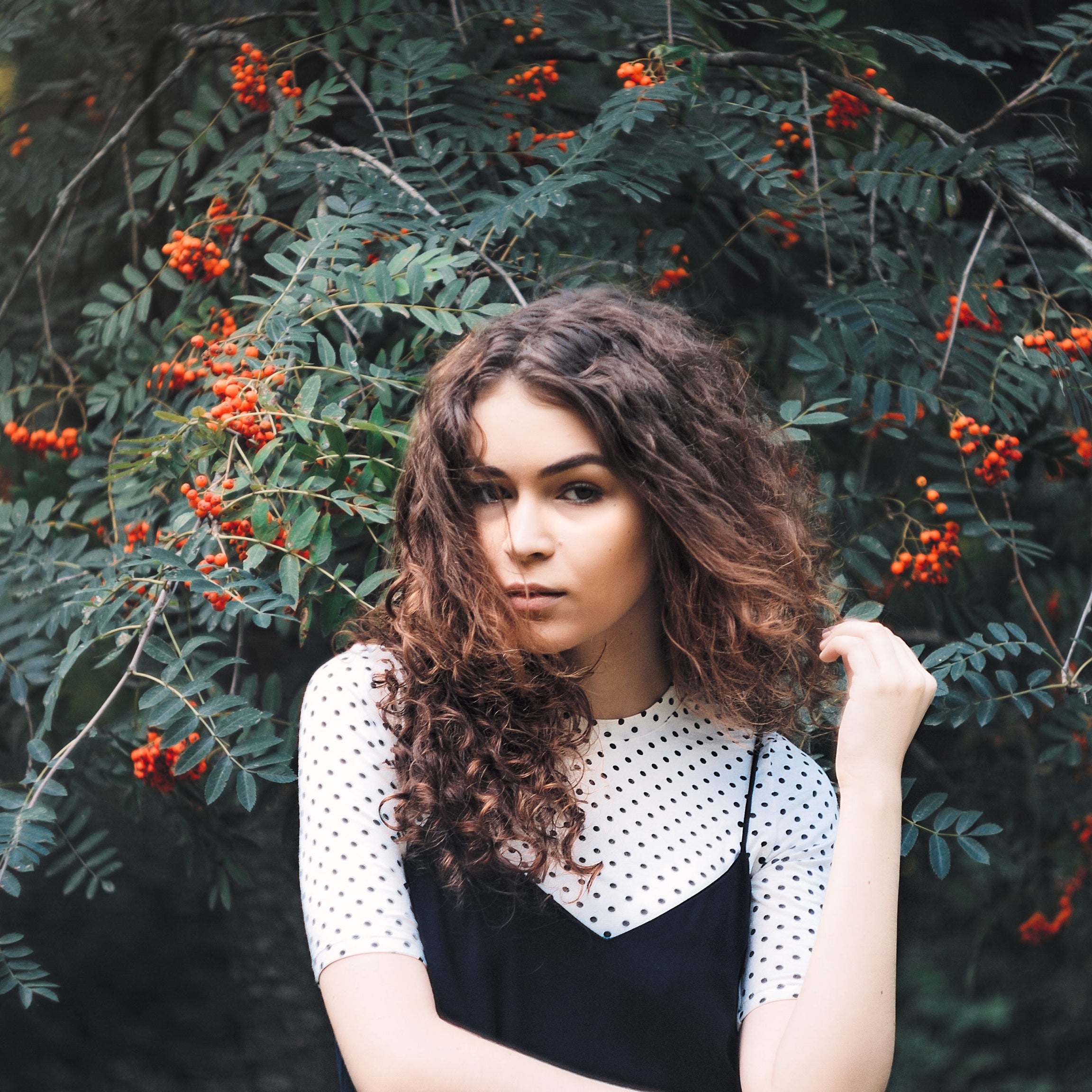 files/woman-infront-of-tree-with-berries.jpeg